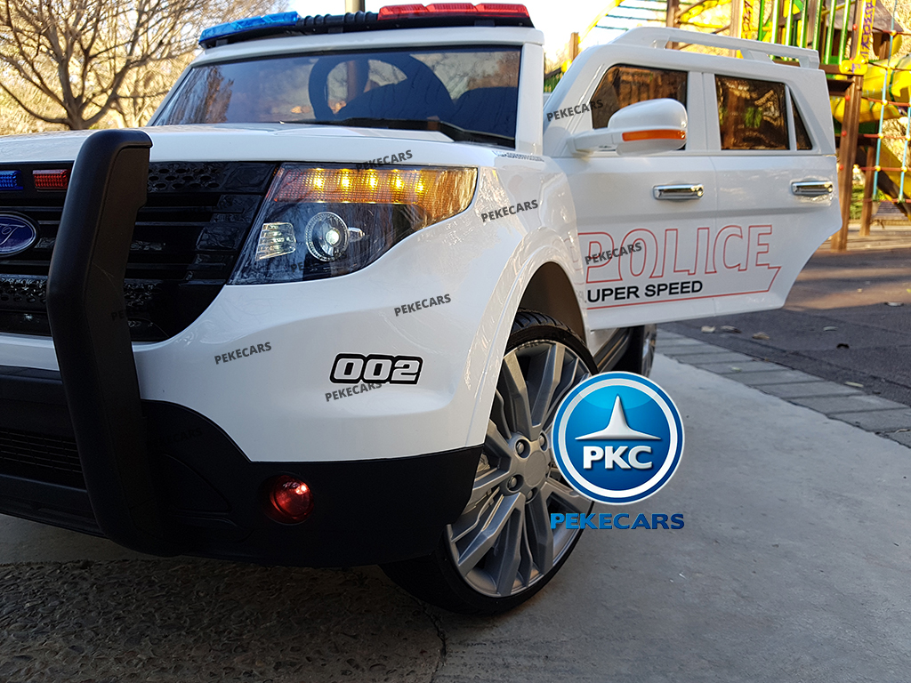 Coche eléctrico de Policia Blanco 12V 2.4G lateral atrás