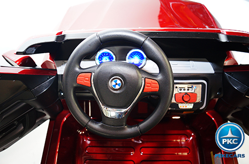 Coche electrico infantil bmw x5 style Burdeos Metalizado volante con claxon y música