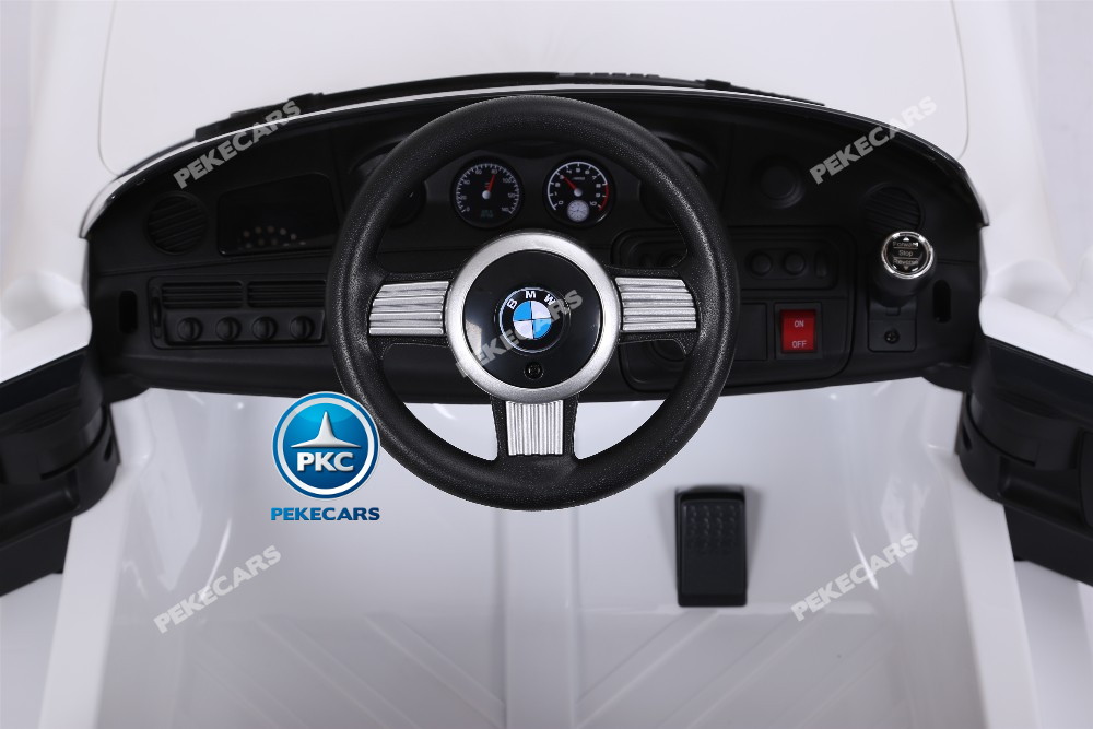 Coche eléctrico infantil BMW Z8 12V Blanco volante con claxon y musica