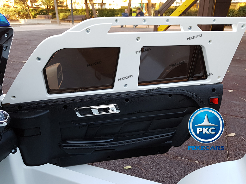 Coche electrico de policia infantil Blanco detalles de la puerta