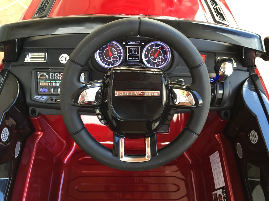 Coche electrico para niños evoque style rojo metalizado volante con musica y claxon