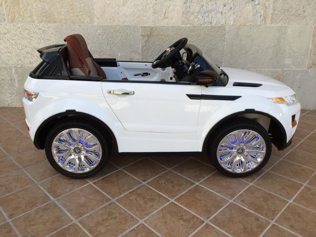 Coche electrico infantil evoque style blanco con luces en las ruedas