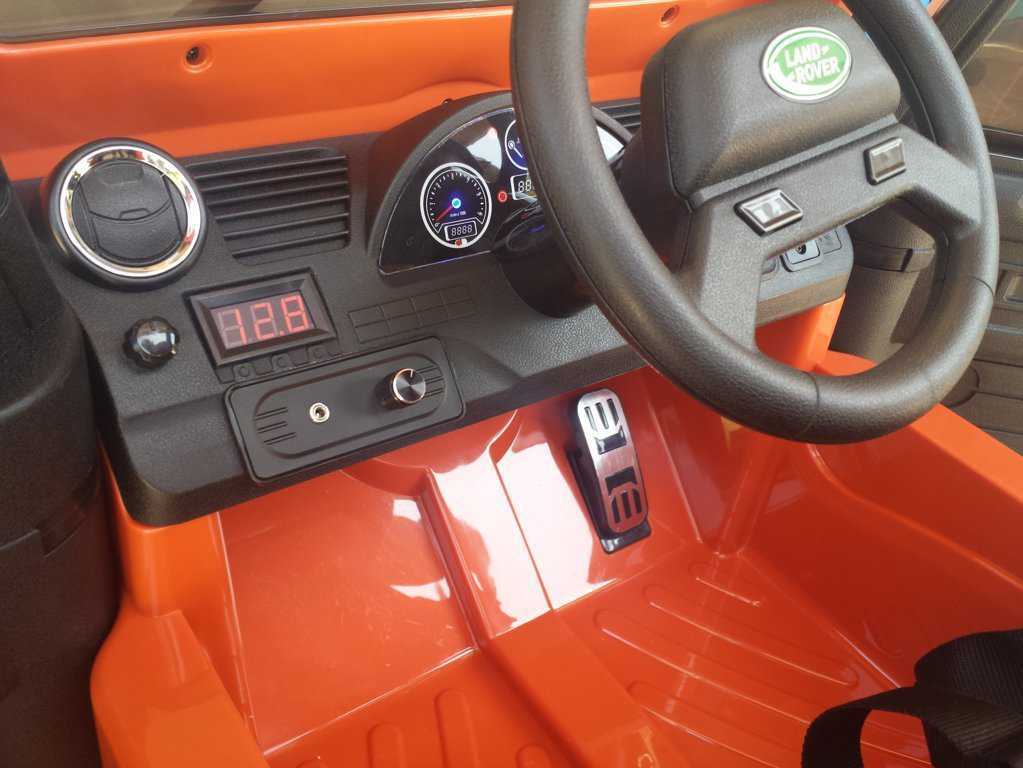 Todoterreno electrico infantil Land Rover Defender Naranja salpicadero