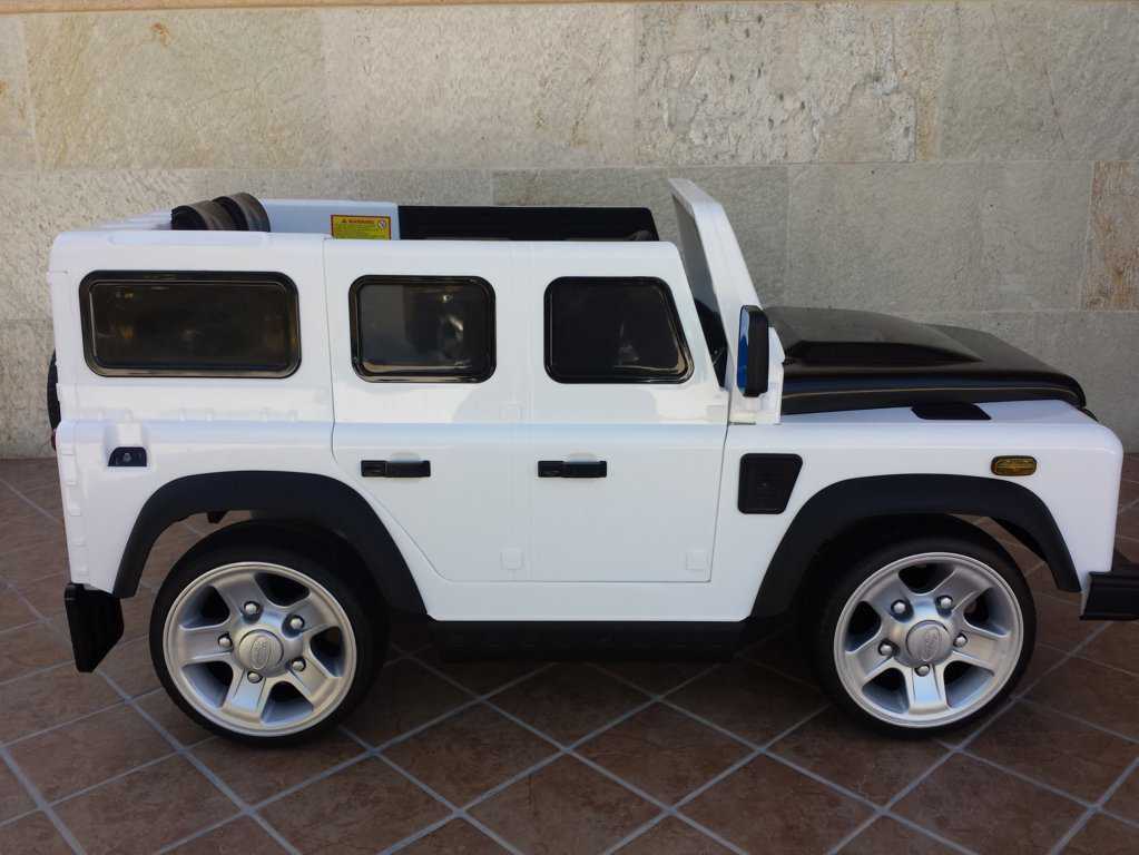 Todoterreno electrico infantil Land Rover Defender Blanco visto de lado