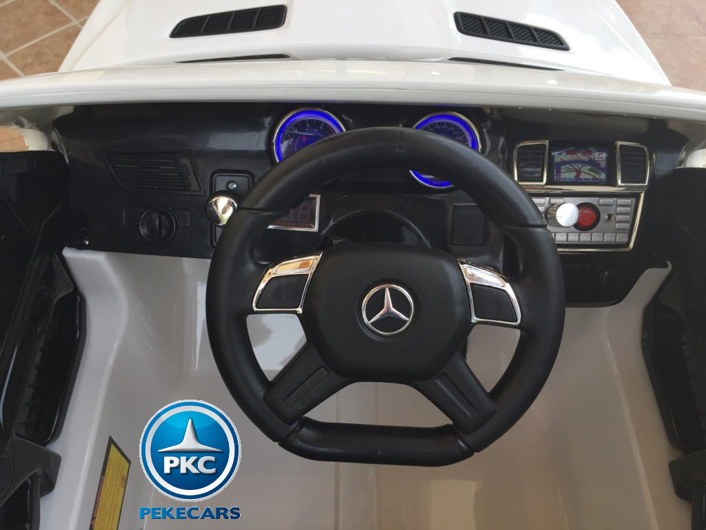 Coche electrico para niños Mercedes GL63 Blanco volante con musica y claxon