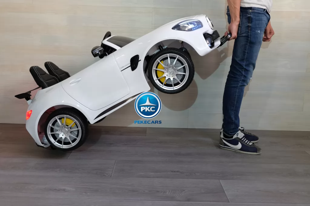 Coche electrico para niños Mercedes GTR 2 plazas Rosa con asa de transporte