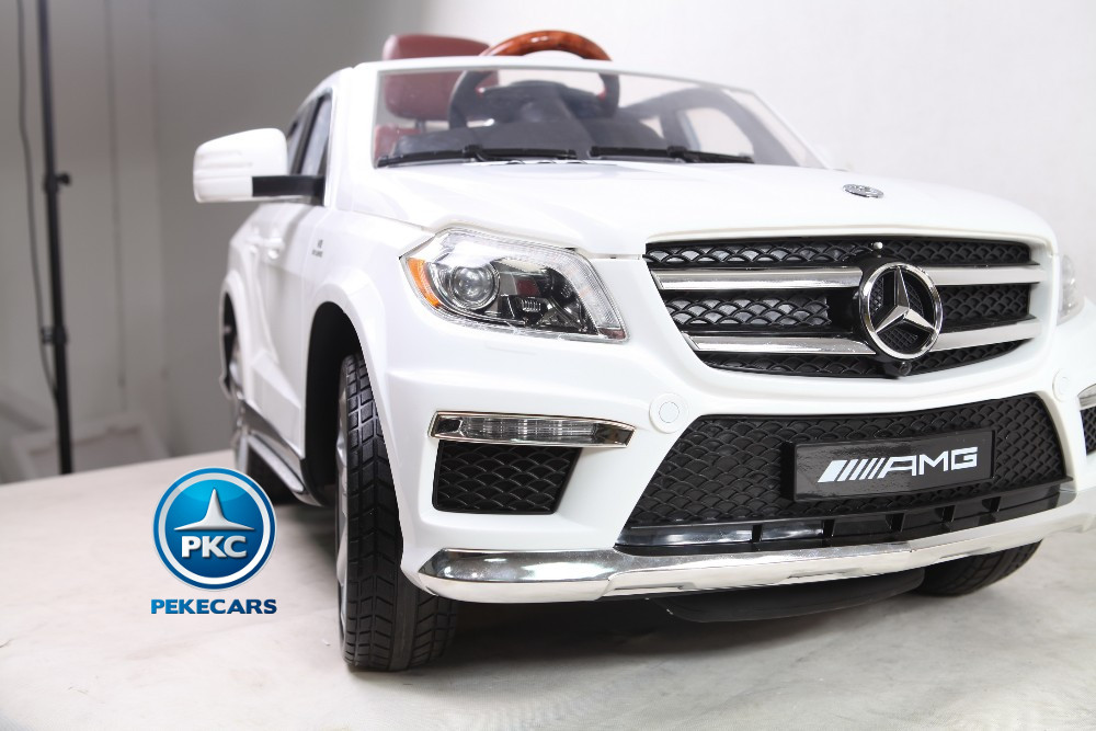 Coche electrico para niños Mercedes GL63 Version Superior Blanco con asa de transporte