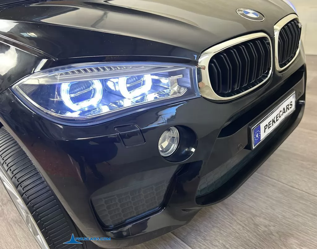 Coche electrico para niños BMW X6M Negro Metalizado luces frontales
