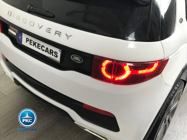 Coche eléctrico para niños Land Rover Discovery 12V MP4 blanco vista faro trasero