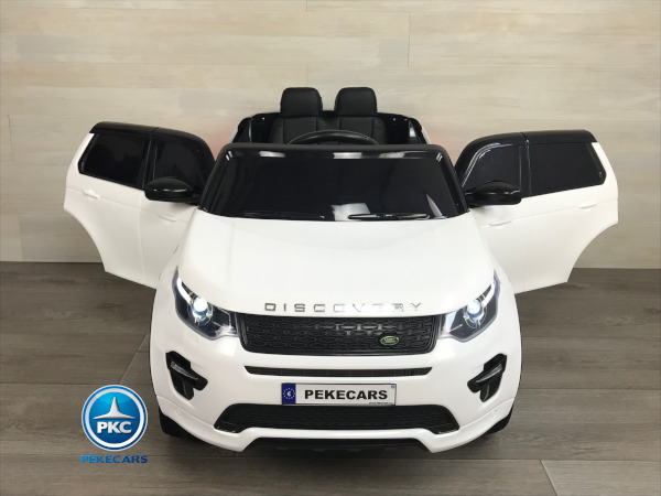 Coche eléctrico para niños Land Rover Discovery 12V MP4 blanco vista de frente puertas abiertas