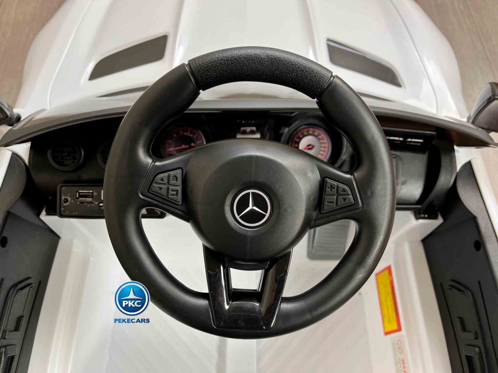Coche electrico para niños Mercedes GTR 12V Blanco vista volante