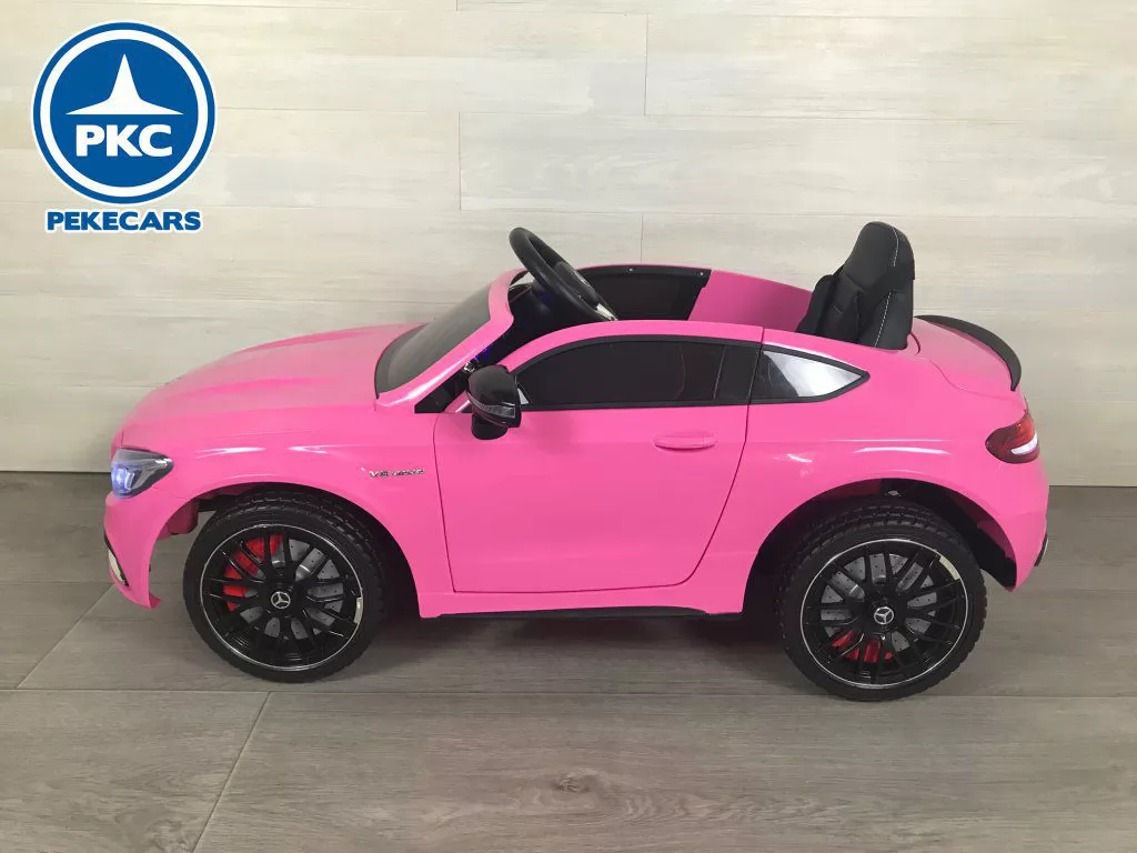 Coche eléctrico para niños Mercedes C63 Rosa vista lateral