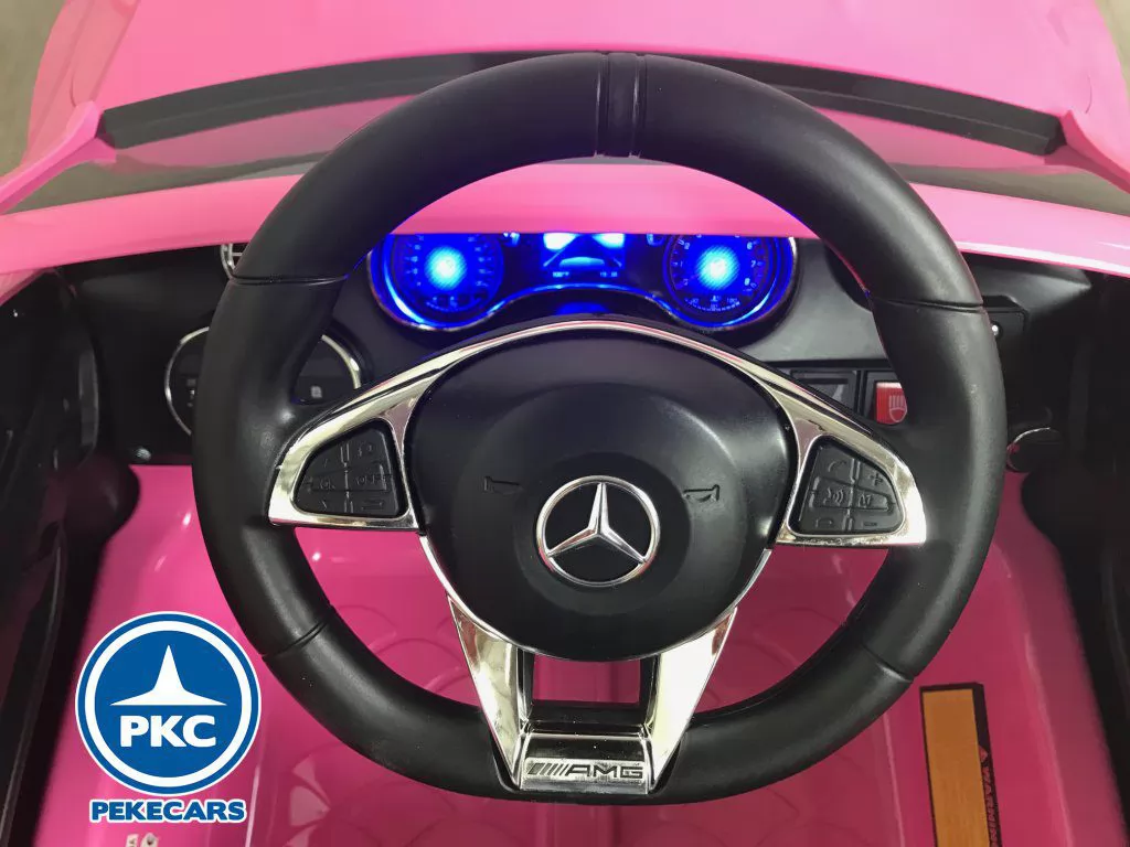 Coche eléctrico para niños Mercedes C63 Rosa vista volante
