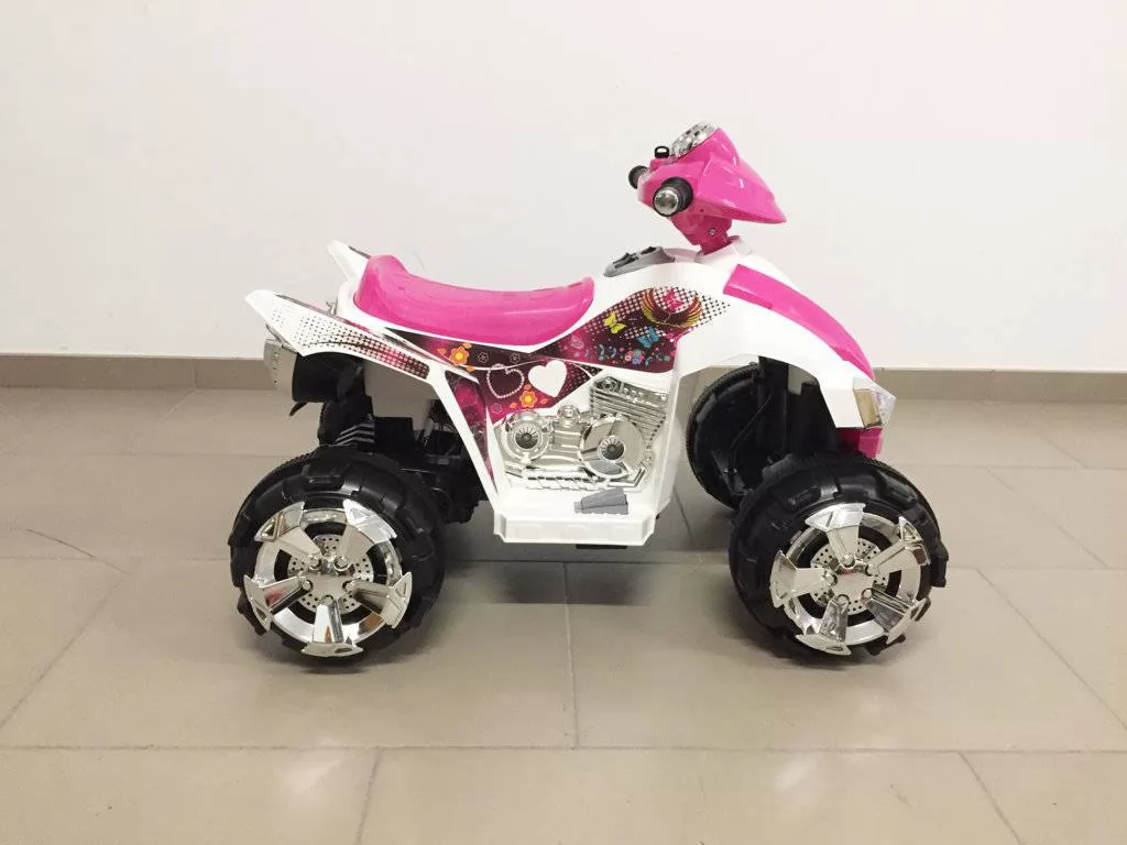 Quad eléctrico infantil Pekecars doble velocidad Rosa de lado