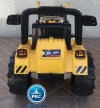 Tractor electrico con pala delantera amarillo vista trasera